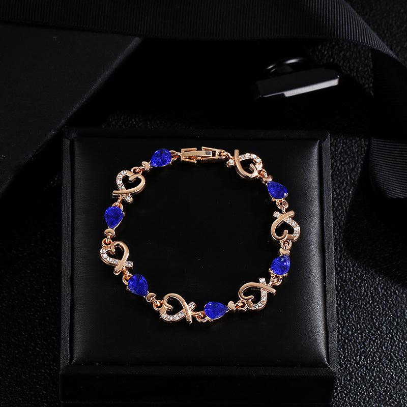 Here’s an optimized and engaging rewrite for your product:  Title Hollow Heart Love Bracelet with Rhinestones - Elegant Valentine’s Day Gift Jewelry